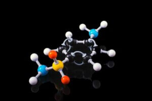 A molecule model with reflection on a dark surrounding.